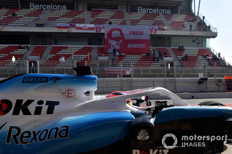 Robert Kubica, Williams FW42 and fans banner in the garndstand