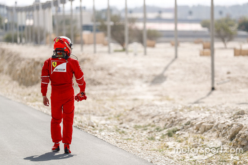 Kimi Raikkonen, Ferrari, heads back to the Ferrari garage