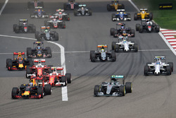 Daniel Ricciardo, Red Bull Racing RB12 and Nico Rosberg, Mercedes AMG F1 Team W07 lead at the start of the race