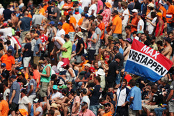 Fans and a flag for Max Verstappen, Red Bull Racing