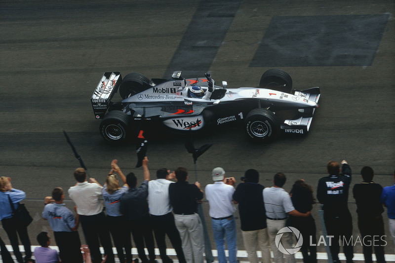 Mika Hakkinen,McLaren MP4/14 Mercedes-Benz, celebrates victory at the finish