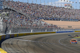 Brad Keselowski, Team Penske, Ford Fusion Autotrader drives under the checkered flag to win