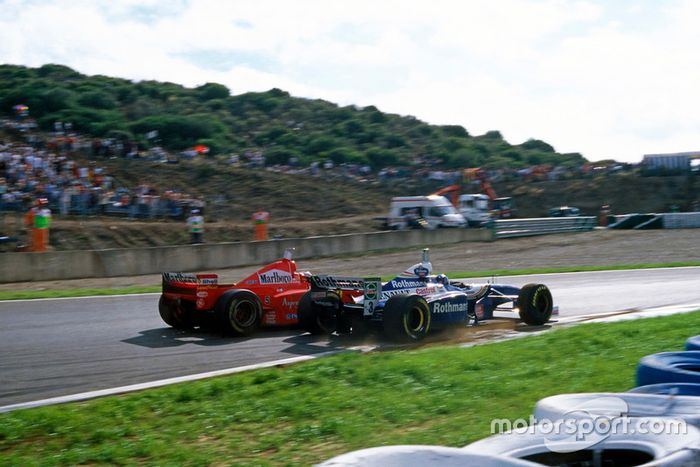 Michael Schumacher, Ferrari F310B, Jacques Villeneuve, Williams FW19 Renault