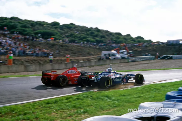Michael Schumacher, Ferrari F310B, Jacques Villeneuve, Williams FW19 Renault