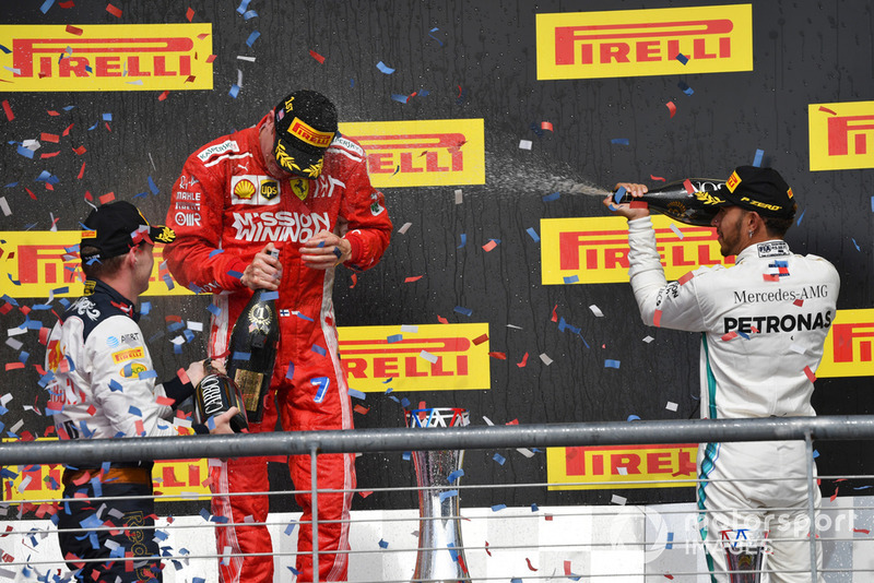Max Verstappen, Red Bull Racing, Kimi Raikkonen, Ferrari and Lewis Hamilton, Mercedes AMG F1 celebrate on the podium with the champagne