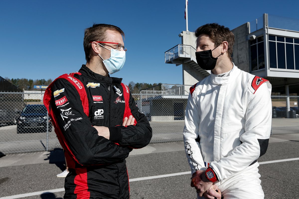 Grosjean chats with AJ Foyt Racing-Chevrolet's Sebastien Bourdais. 