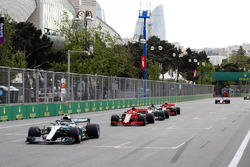 Valtteri Bottas, Mercedes AMG F1 W09, leads Sebastian Vettel, Ferrari SF71H, Lewis Hamilton, Mercedes AMG F1 W09, and Kimi Raikkonen, Ferrari SF71H at the restart