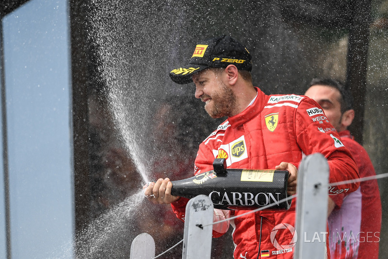 Sebastian Vettel, Ferrari celebrates on the podium with the champagne