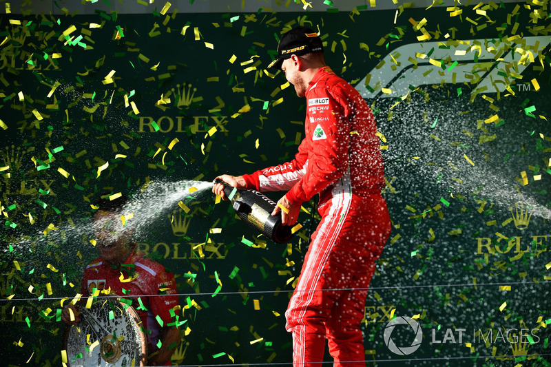 Race winner Sebastian Vettel, Ferrari celebrates with the champagne on the podium