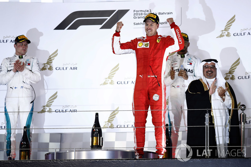 Valtteri Bottas, Mercedes AMG F1, 2nd position, Sebastian Vettel, Ferrari, 1st position, and Lewis Hamilton, Mercedes AMG F1, 3rd position, on the podium