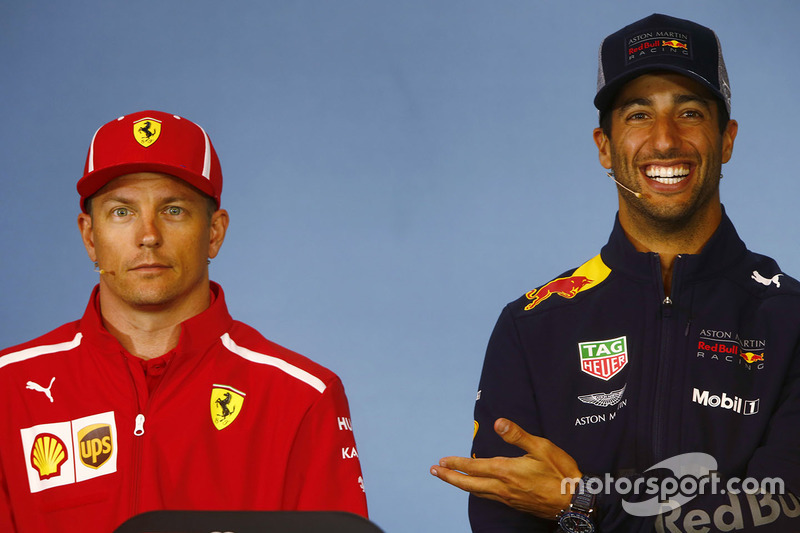 Kimi Raikkonen, Ferrari, and Daniel Ricciardo, Red Bull Racing, share a joke in the Thursday press conference