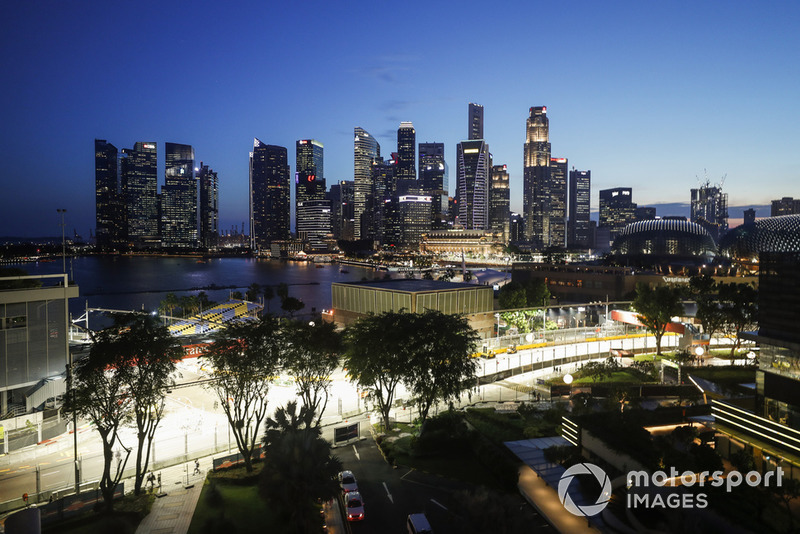 The track is built as darkness falls over the Singapore skyline