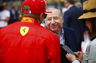 Jean Todt, President, FIA, talks to Kimi Raikkonen, Ferrari, on the grid