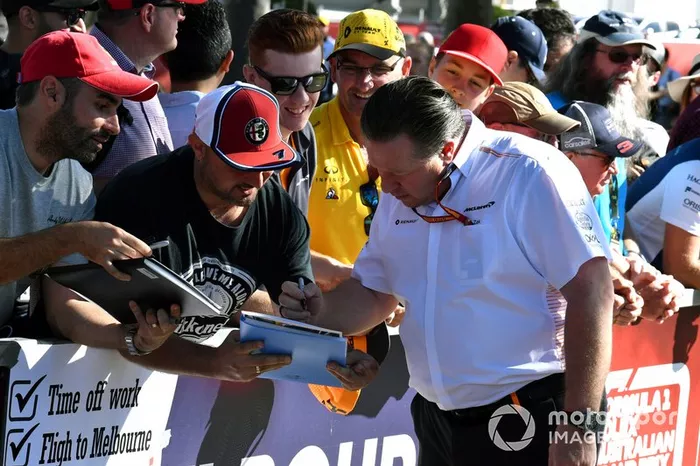 Zak Brown, Executive Director, McLaren signs autographs for fans.