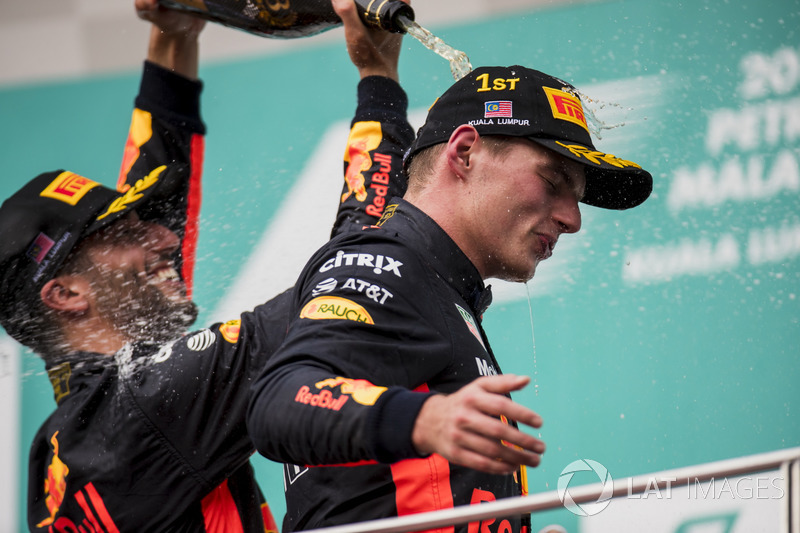 third place Daniel Ricciardo, Red Bull Racing, pours Champagne down the back of Max Verstappen, Red Bull Racing, race winner, on the podium