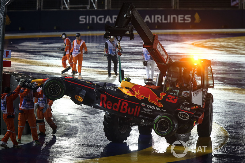 The car of Max Verstappen, Red Bull Racing RB13 is recovered by Marshals after crashing out at the start of the race