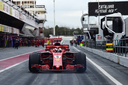 Jo Bauer, FIA Technical Delegate watches Sebastian Vettel, Ferrari SF71H in pit lane