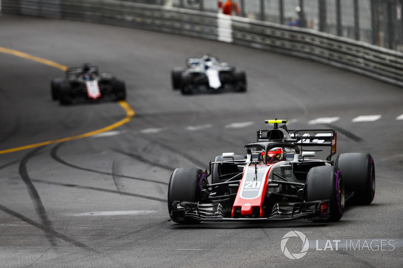 Kevin Magnussen, Haas F1 Team VF-18, leads Lance Stroll, Williams FW41, and Romain Grosjean, Haas F1 Team VF-18