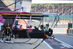 The crashed car of Romain Grosjean, Haas F1 Team VF-18 is returned to the pits