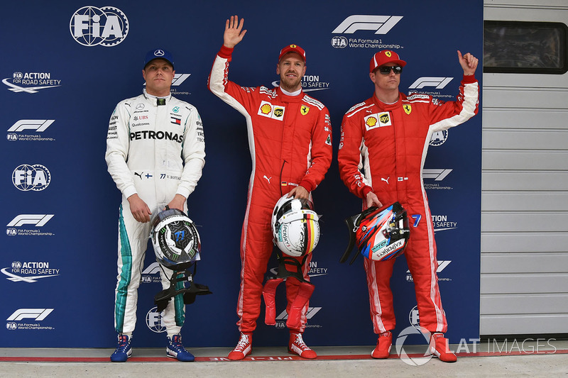 Polesitter Sebastian Vettel, Ferrari, second place Kimi Raikkonen, Ferrari, third place Valtteri Bottas, Mercedes AMG F1