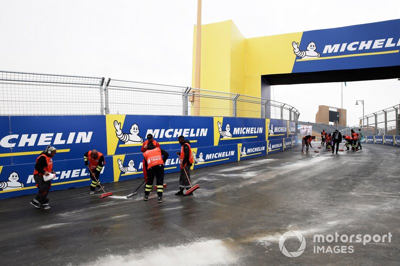 Marshals clear the track