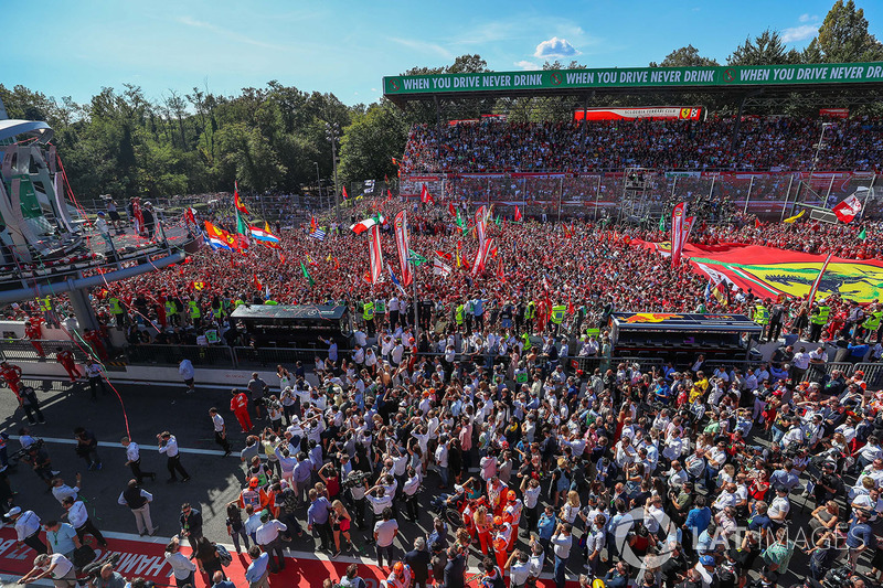 Sebastian Vettel, Ferrari and Lewis Hamilton, Mercedes AMG F1 celebrate on the podium, Ferrari Fans and flags at the podium celebrations