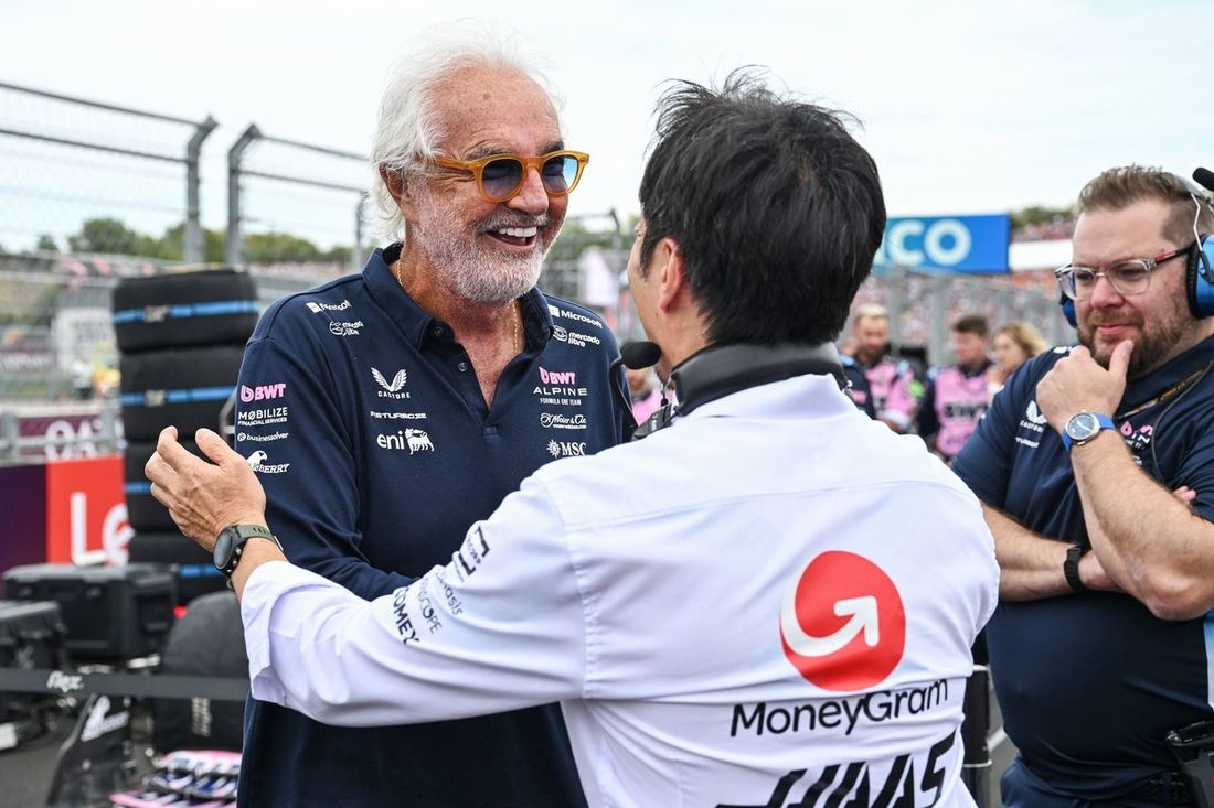 Flavio Briatore, Executive Advisor of Alpine F1 and Ayao Komatsu, Team Principal of Haas F1 on the grid.