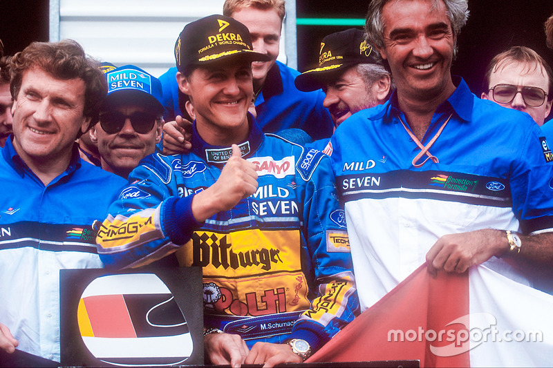 World Champion Michael Schumacher celebrates the Benetton team, Tom Walkinshaw and Flavio Briatore