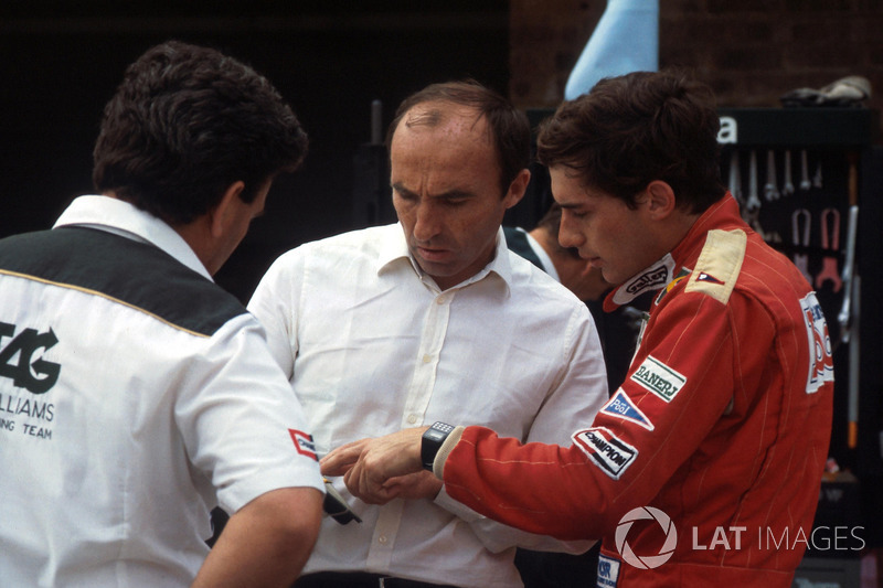 Ayrton Senna, discusses his first run in the Williams FW08C with team owner Frank Williams and Allan Challis Williams Team Manager