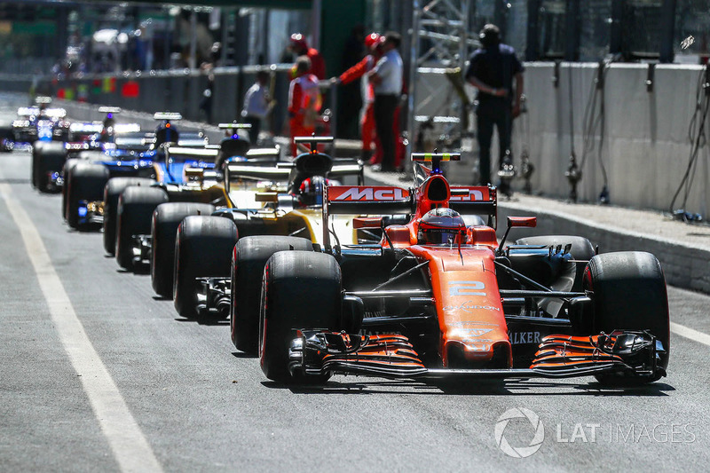 Cars line up in the pitlane