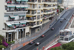 Jenson Button, McLaren MP4-31 and Esteban Gutierrez, Haas F1 Team VF-16