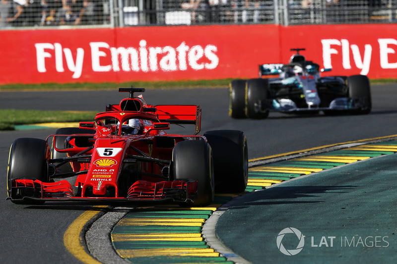 Sebastian Vettel, Ferrari SF71H leads Lewis Hamilton, Mercedes-AMG F1 W09