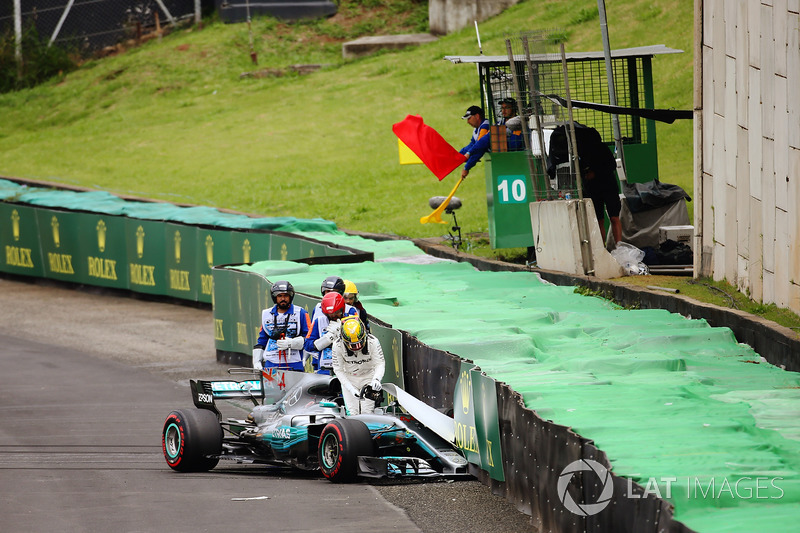 Lewis Hamilton, Mercedes AMG F1 W08, climbs out of his damaged car after crashing out of Q1