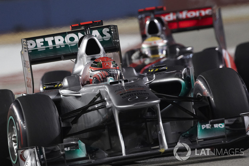 Michael Schumacher, Mercedes MGP W02; Lewis Hamilton, McLaren MP4-26