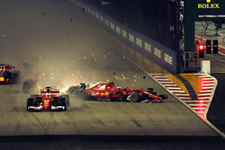 Sebastian Vettel, Ferrari SF70H leads at the start of the race and the cars of Kimi Raikkonen, Ferrari SF70H and Max Verstappen, Red Bull Racing RB13 crash after colliding