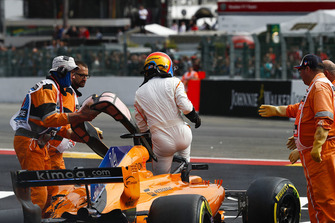 Fernando Alonso, McLaren MCL33, exits his car after crashing over Charles Leclerc, Sauber C37, following contact from Nico Hulkenberg, Renault Sport F1 Team R.S. 18, at the start