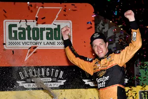 Brad Keselowski, Team Penske, Ford Fusion Miller Genuine Draft celebrates his win