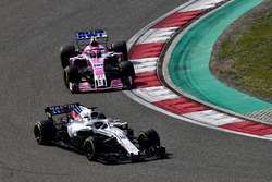 Lance Stroll, Williams FW41 and Esteban Ocon, Force India VJM11