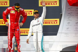 Kimi Raikkonen, Ferrari, 3rd position, Lewis Hamilton, Mercedes AMG F1, 1st position, on the podium