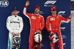 Le poleman Sebastian Vettel, Ferrari, le second Kimi Raikkonen, Ferrari, le troisième Valtteri Bottas, Mercedes AMG F1