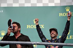 Actor Gerard Butler does a shoey on the podium with 3rd place Daniel Ricciardo, Red Bull Racing