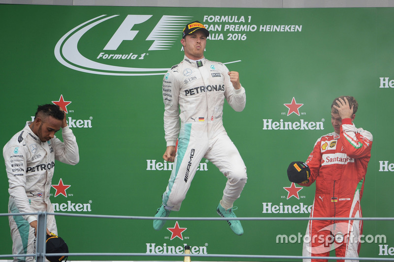 The podium (L to R): second place Lewis Hamilton, Mercedes AMG F1; Race winner Nico Rosberg, Mercede