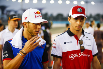 Charles Leclerc, Sauber, talks to Pierre Gasly, Toro Rosso.