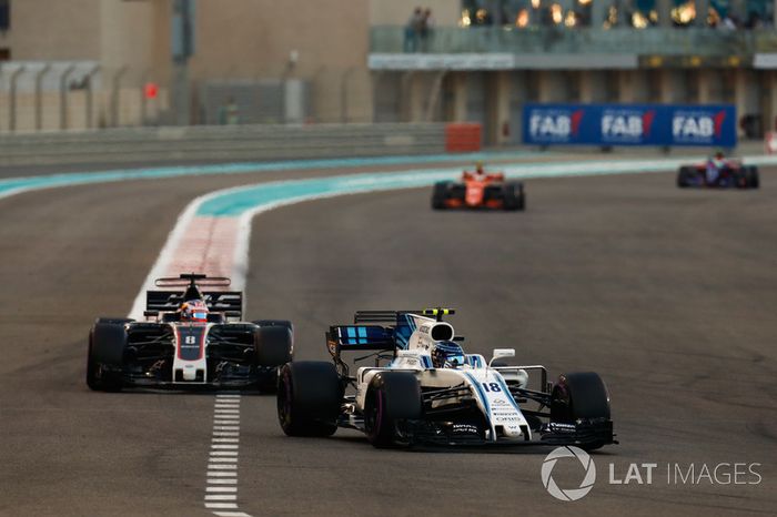 Lance Stroll, Williams FW40, Romain Grosjean, Haas F1 Team VF-17