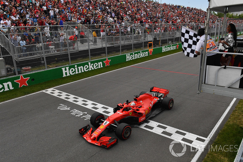 Race winner Sebastian Vettel, Ferrari SF71H takes the chequered flag