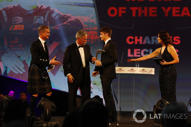 Charles Leclerc receives his rookie of the year award from Chase Carey, Chairman, Formula One