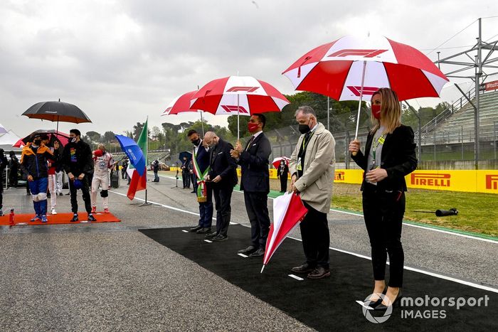 Dignitaries including Stefano Bonaccini, President of Emilia-Romagna, and Luigi Di Maio, Minister of Foreign Affairs, stand for the national anthem