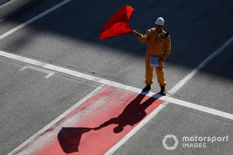 Marshal waves the red flag