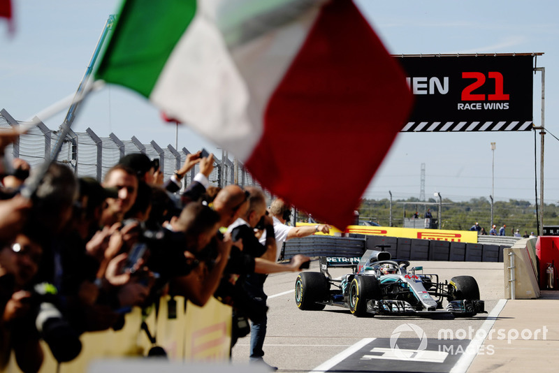 Lewis Hamilton, Mercedes AMG F1 W09 EQ Power+, returns to Parc Ferme as the Ferrari team celebrate with an Italian flag