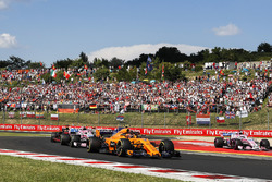 Stoffel Vandoorne, McLaren MCL33, leads Esteban Ocon, Force India VJM11, and Daniel Ricciardo, Red Bull Racing RB14